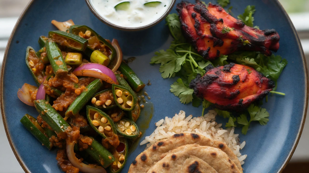 Healthy Indian plate with tandoori chicken, okra masala, rotis, and raita.